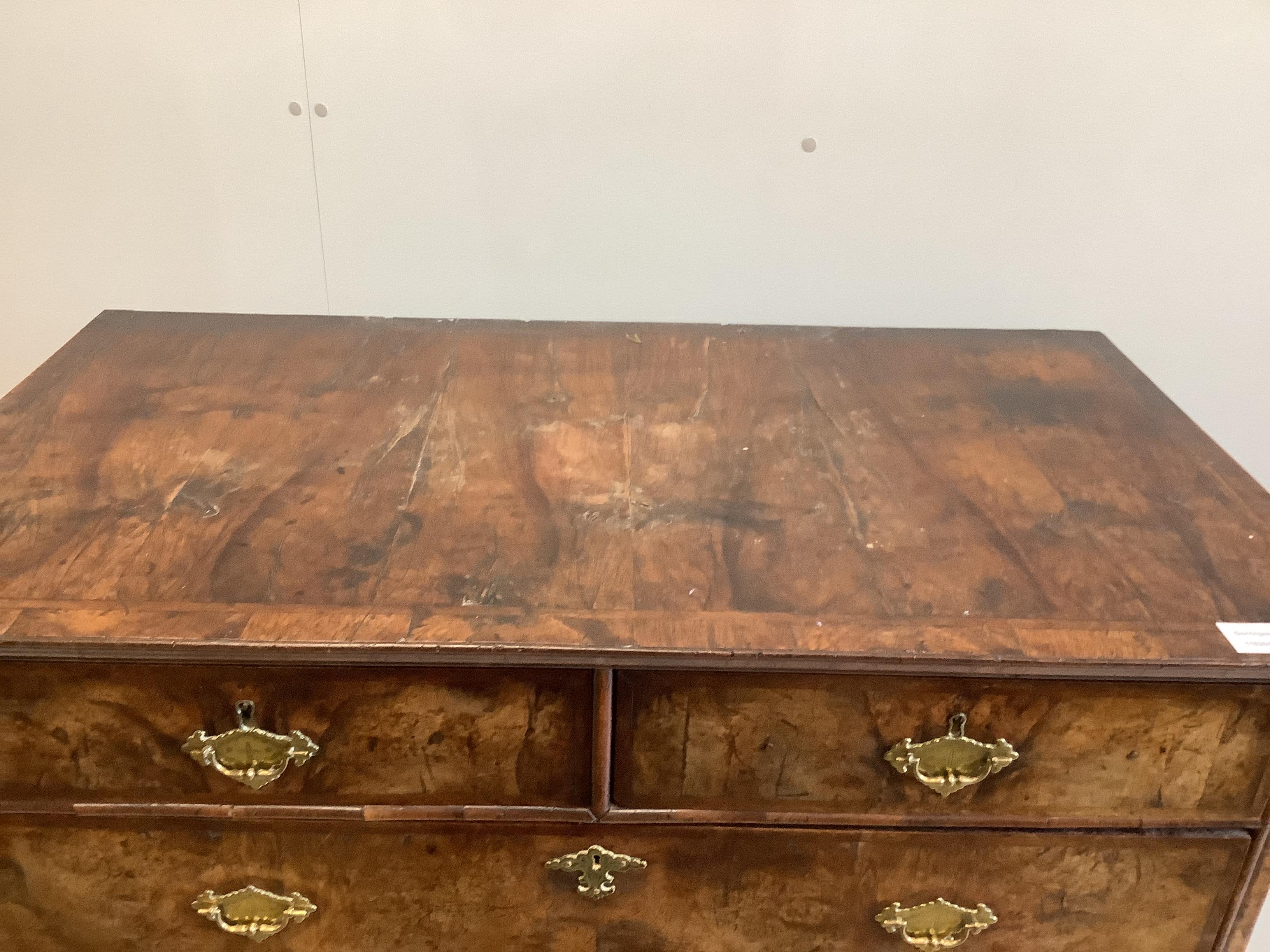 An 18th century feather banded walnut chest on stand, width 105cm, depth 58cm, height 117cm